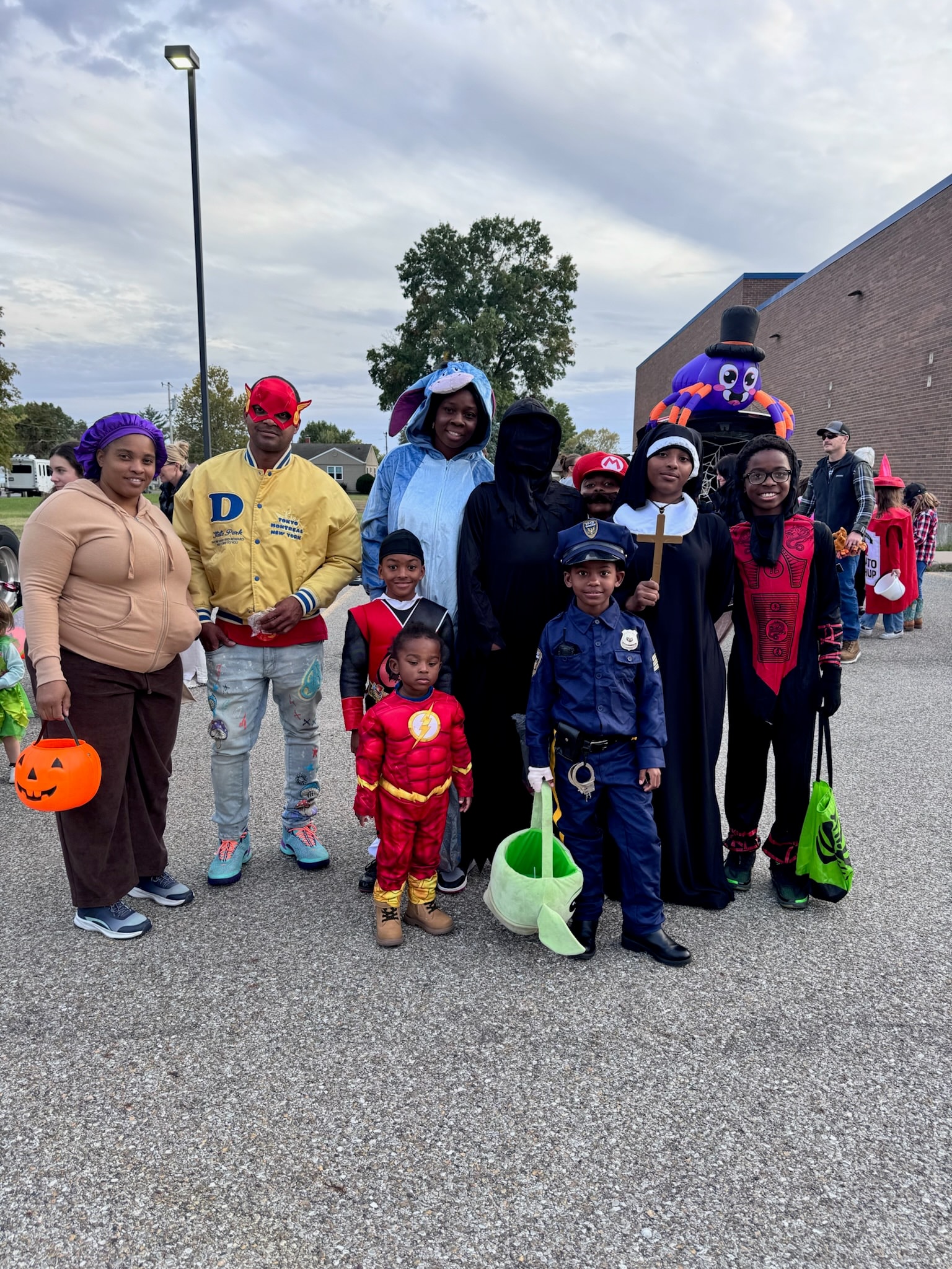 Families and children in costumes at the YMCA Trunk or Treat event